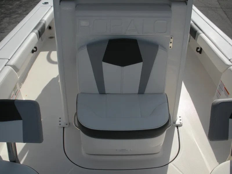 Slide: The Image of 2026 Robalo R246 Caymann boat seating area with sleek, modern design and comfortable upholstery. - 4