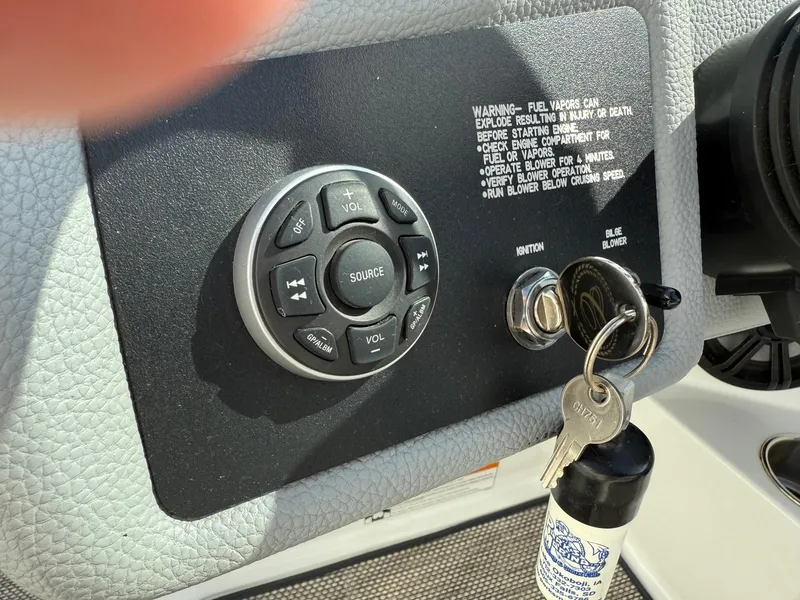 Slide: The Image of Control panel of a 2015 Cobalt 220 boat with ignition keys and warning label. - 19