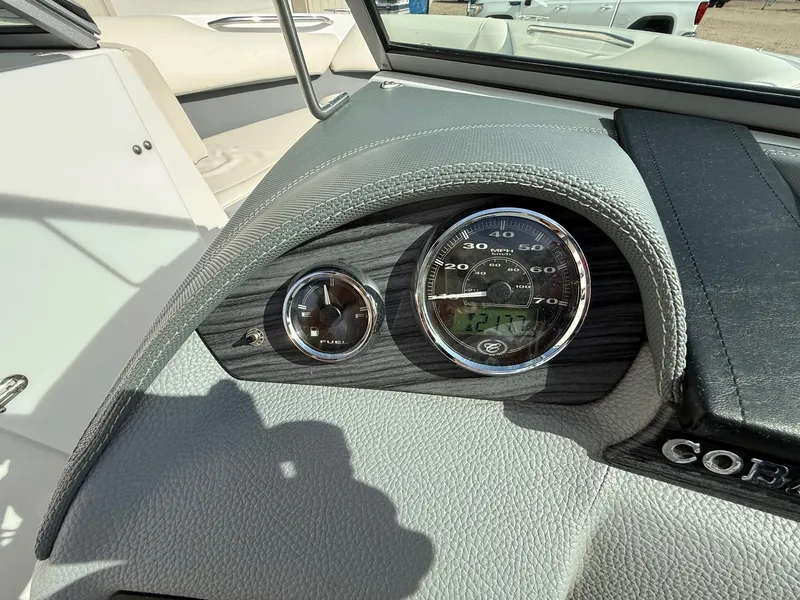 Slide: The Image of Dashboard of a 2015 Cobalt 220 boat with speedometer and fuel gauge. - 20