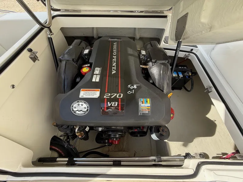 Slide: The Image of Volvo Penta 270 V8 engine in 2015 Cobalt 220 boat, open engine compartment. - 24