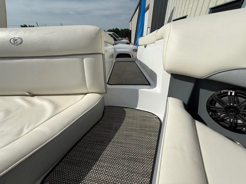 Slide: The Image of Interior of a 2015 Cobalt 220 boat with white seating and speaker. - 27