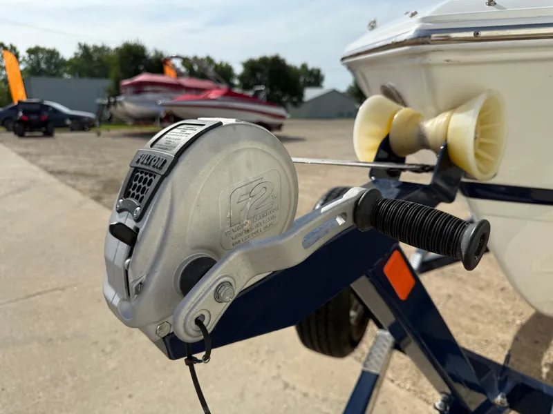 Slide: The Image of Boat trailer winch on a 2015 Cobalt 220, parked outdoors. - 31