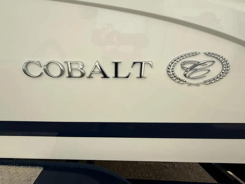 Slide: The Image of Cobalt 220 boat emblem, 2015 model, featuring sleek silver lettering and logo. - 4