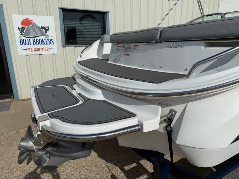 Slide: The Image of 2015 Cobalt 220 boat at Boji Brokers dealership, rear view with propeller. - 7
