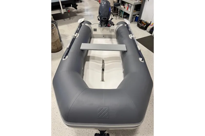 Slide: The Image of West Marine Compact Rib-310 inflatable boat, 2022 model, in a workshop. - 14