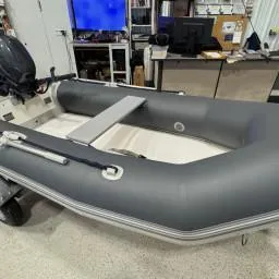 Slide: The Image of 2022 West Marine Compact Rib-310 inflatable boat in a workshop setting. - 4