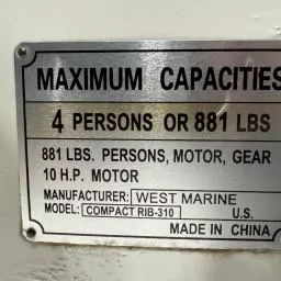 Slide: The Image of Capacity plate for 2022 West Marine Compact Rib-310, max 4 persons or 881 lbs, 10 HP motor. - 6
