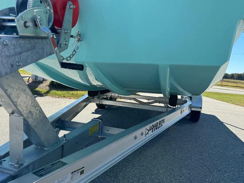 Slide: The Image of Bay Rider 2260 Skiff 2025 on Load Rite trailer, showcasing boat hull and trailer details. - 4