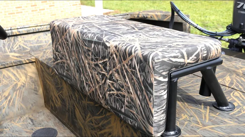 Slide: The Image of Camouflage seat on 2025 G3 Bay 17 boat, featuring a sturdy metal frame. - 13