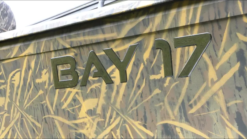 Slide: The Image of 2025 G3 Bay 17 boat with camouflage design and bold lettering. - 21