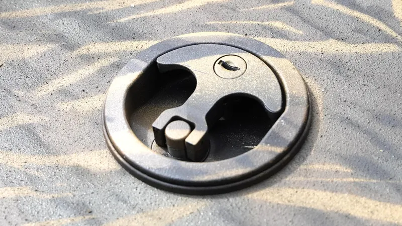 Slide: The Image of Close-up of a G3 Bay 17 boat latch, 2025 model, on textured surface. - 24