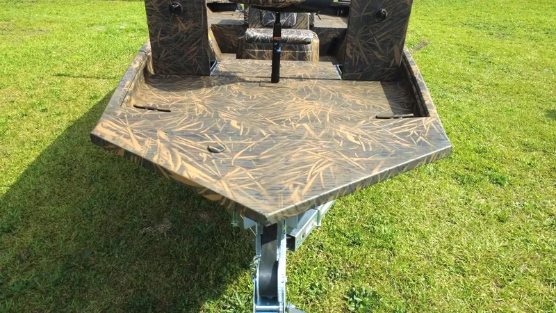 Slide: The Image of 2025 G3 Bay 17 boat with camouflage pattern on grassy field. - 6