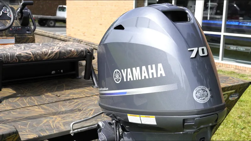 Slide: The Image of Yamaha 70 outboard motor on 2025 G3 Bay 17 boat, featuring camo design. - 9
