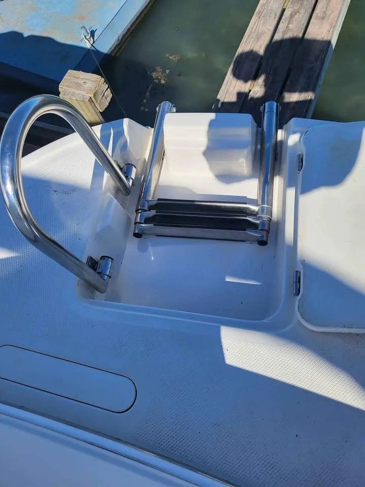 Slide: The Image of Stainless steel boat ladder on 2005 Monterey 263 ES Explorer, dockside view. - 7