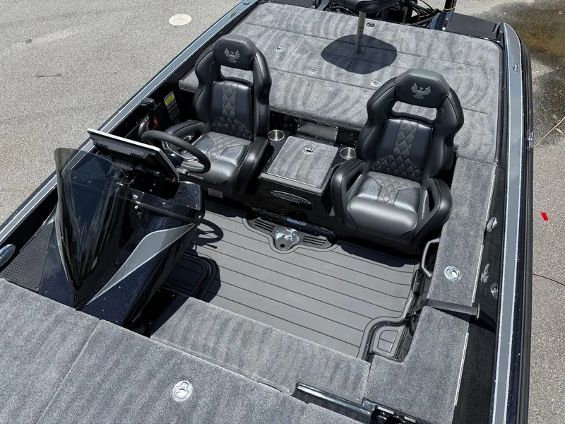 Slide: The Image of 2026 Phoenix 920 ELITE X II boat interior with dual leather seats and modern dashboard. - 11