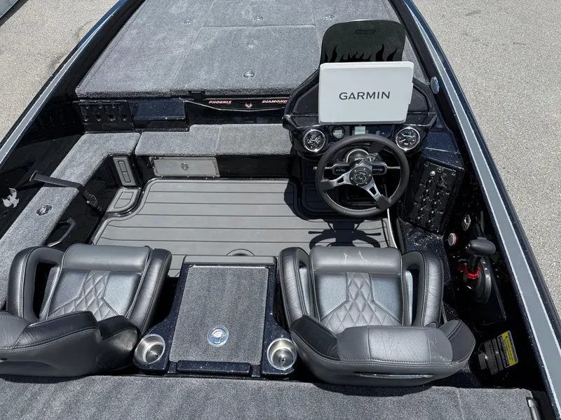 Slide: The Image of 2026 Phoenix 920 ELITE X II boat interior with Garmin navigation system and leather seats. - 14
