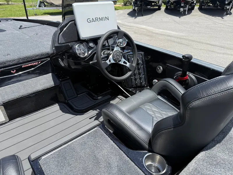 Slide: The Image of 2026 Phoenix 920 ELITE X II boat cockpit with Garmin display and leather seating. - 16