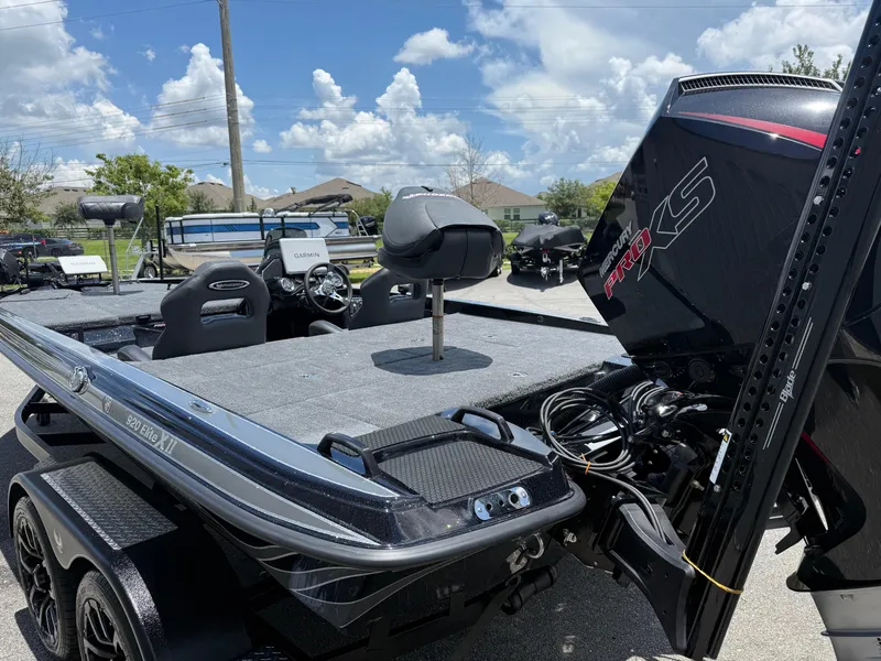 Slide: The Image of 2026 Phoenix 920 ELITE X II boat with Mercury Pro XS engine, parked outdoors. - 18