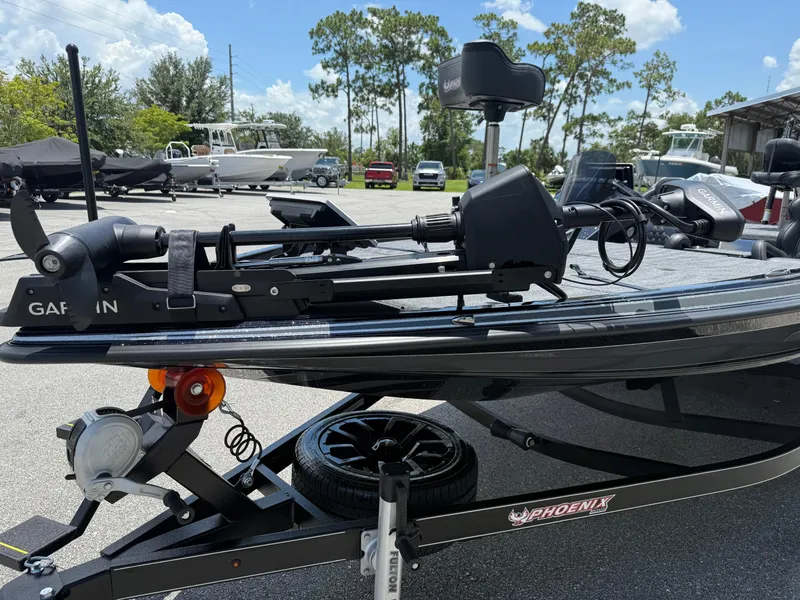 Slide: The Image of 2026 Phoenix 920 ELITE X II boat on trailer with Garmin equipment, parked outdoors. - 3
