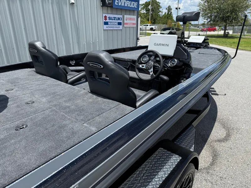Slide: The Image of 2026 Phoenix 920 ELITE X II boat with Garmin system, displayed at Suzuki Marine dealer. - 7