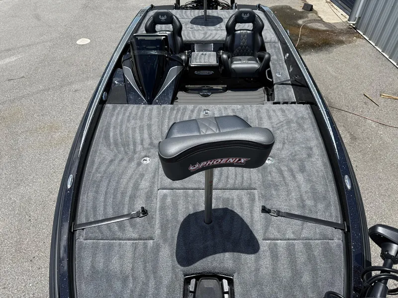 Slide: The Image of 2026 Phoenix 920 ELITE X II boat interior with gray carpet and seating. - 8