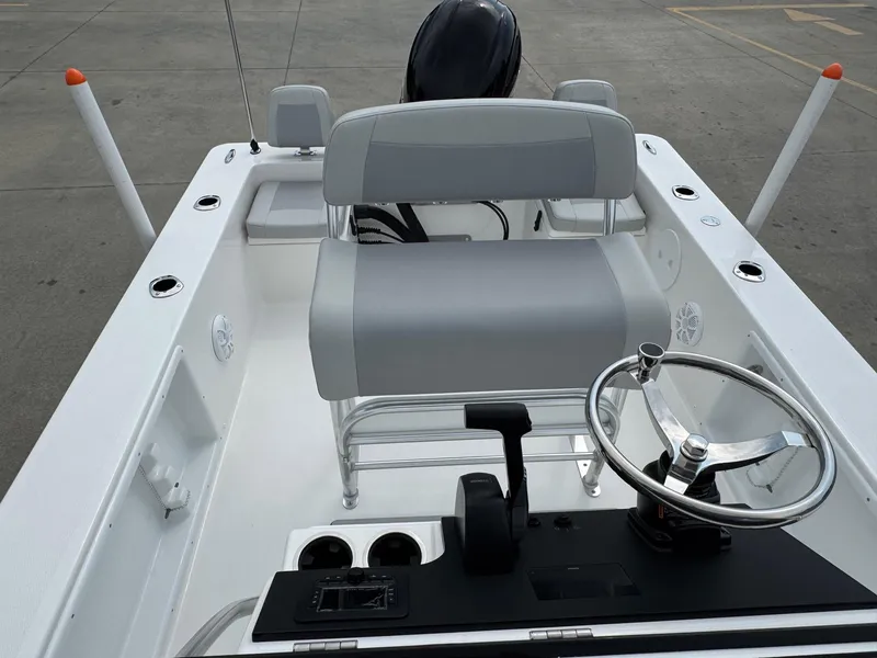 Slide: The Image of 2025 Bay Rider 2060 Skiff interior with steering wheel and seating. - 12