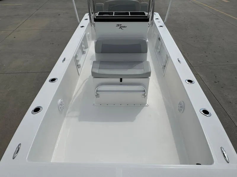 Slide: The Image of 2025 Bay Rider 2060 Skiff boat interior with seating and rod holders. - 7