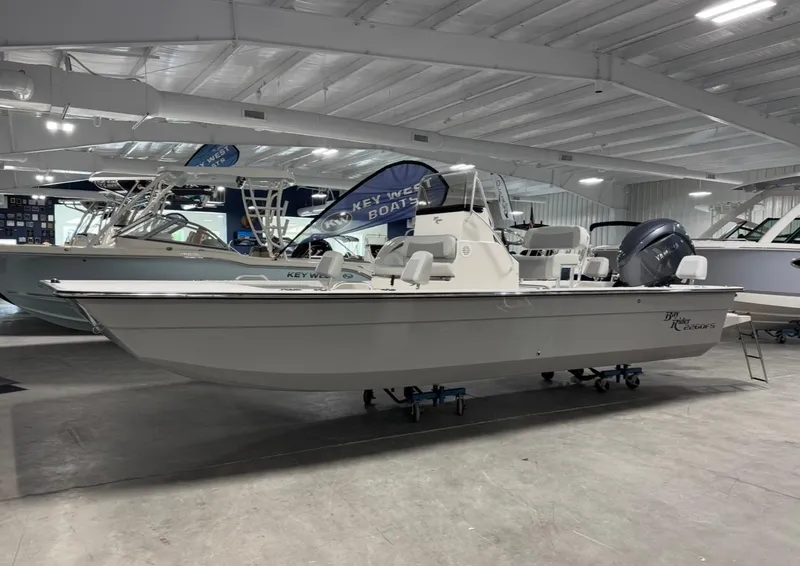 Slide: The Image of 2026 Bay Rider 2260 FS Skiff displayed in a showroom. - 21