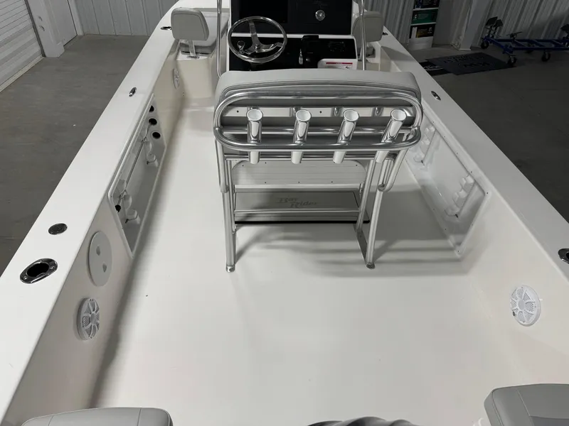 Slide: The Image of 2026 Bay Rider 2260 FS Skiff interior with steering console and rod holders. - 6