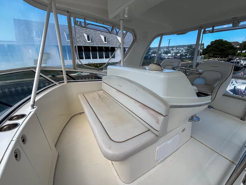 Slide: The Image of 2007 Silverton 38 Convertible yacht interior with seating and helm station. - 10