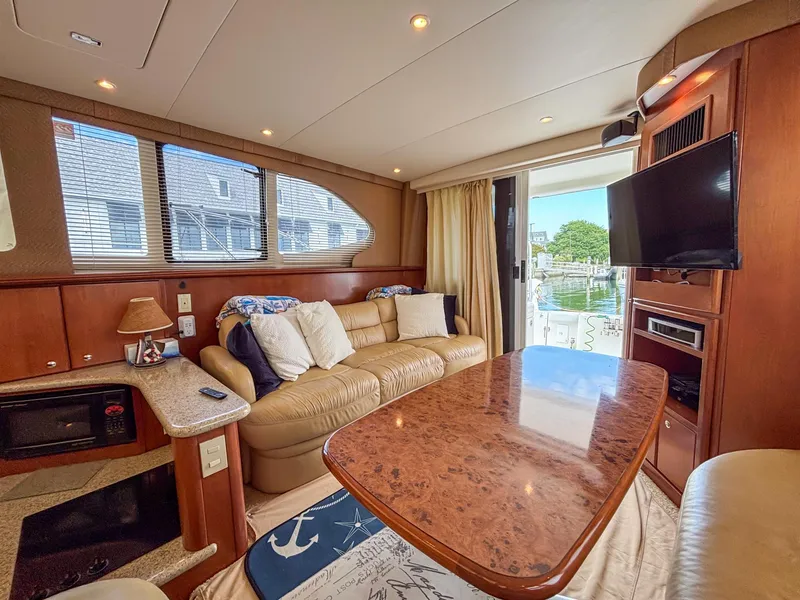Slide: The Image of Luxurious interior of 2007 Silverton 38 Convertible yacht with plush seating and modern amenities. - 14