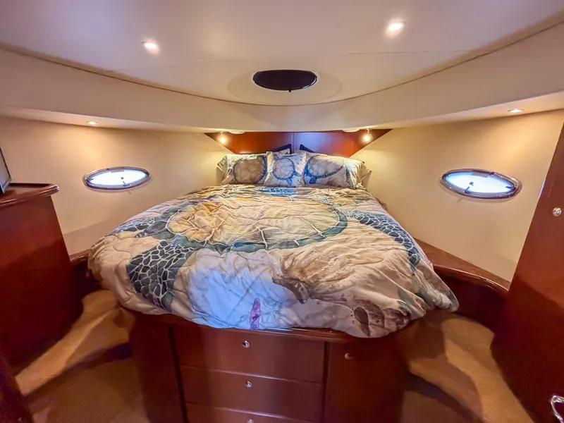 Slide: The Image of Luxurious cabin interior of 2007 Silverton 38 Convertible yacht with cozy bed and ambient lighting. - 20