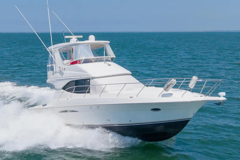 Slide: The Image of 2007 Silverton 38 Convertible yacht cruising on open water. - 3