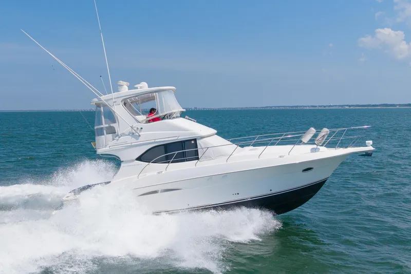 Slide: The Image of 2007 Silverton 38 Convertible yacht cruising on open water. - 31