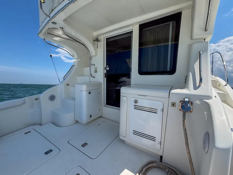 Slide: The Image of 2007 Silverton 38 Convertible yacht deck with ocean view and storage compartments. - 4