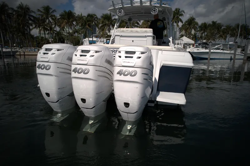 Slide: The Image of 2002 Intrepid 377 Walkaround Cuddy with triple 400 horsepower engines. - 16