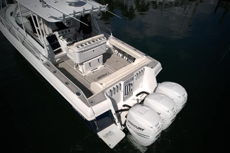 Slide: The Image of 2002 Intrepid 377 Walkaround Cuddy boat with triple Mercury outboard engines. - 20