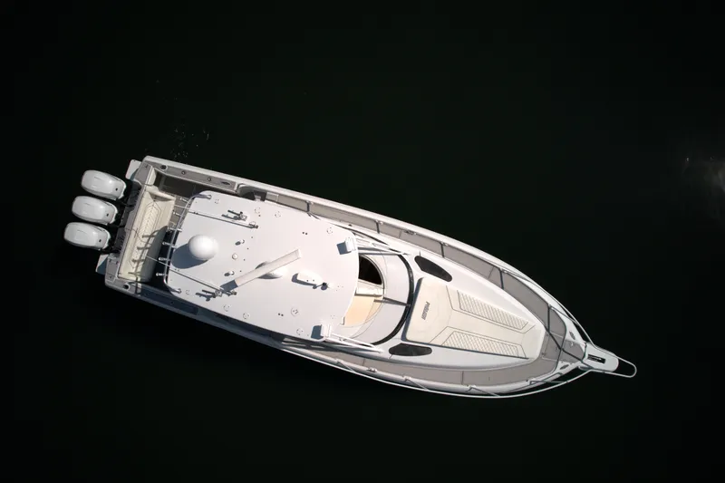Slide: The Image of Aerial view of a 2002 Intrepid 377 Walkaround Cuddy boat on water. - 24