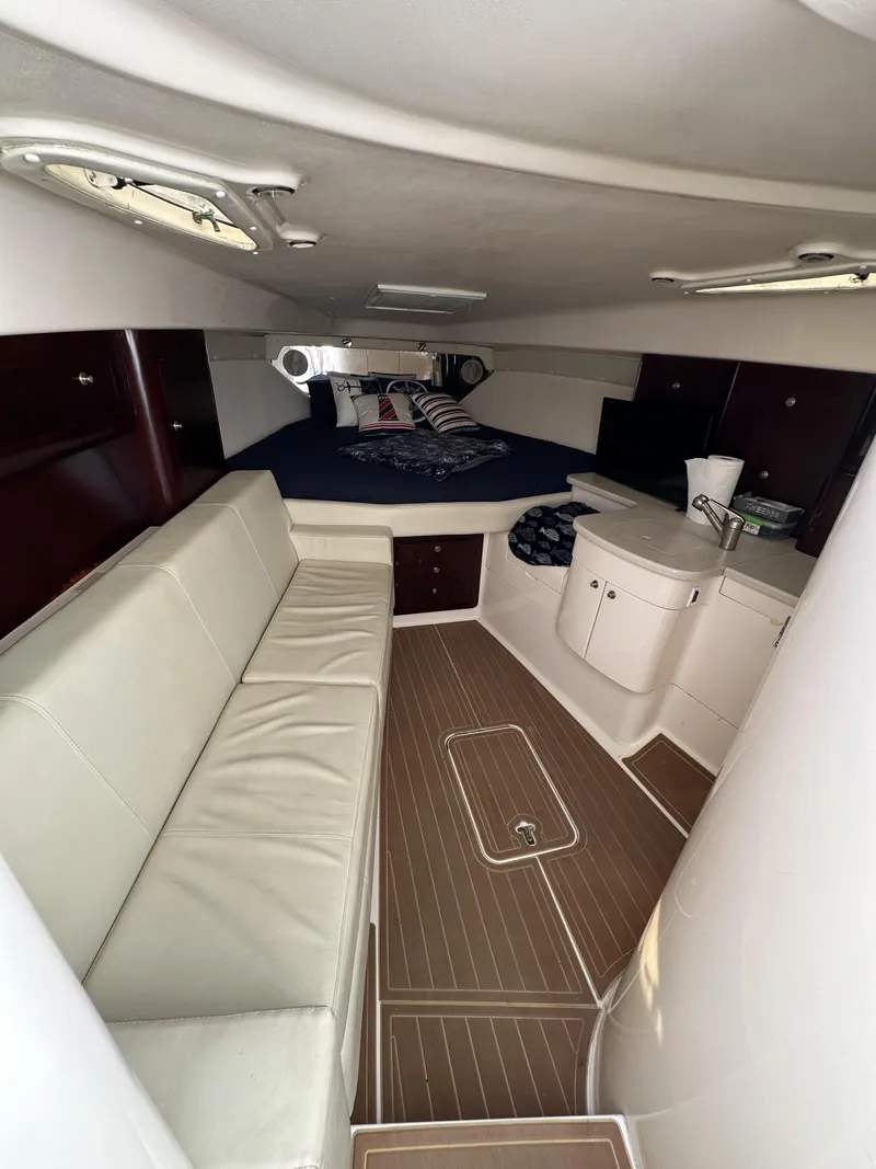 Slide: The Image of 2002 Intrepid 377 Walkaround Cuddy interior with seating and sleeping area. - 41