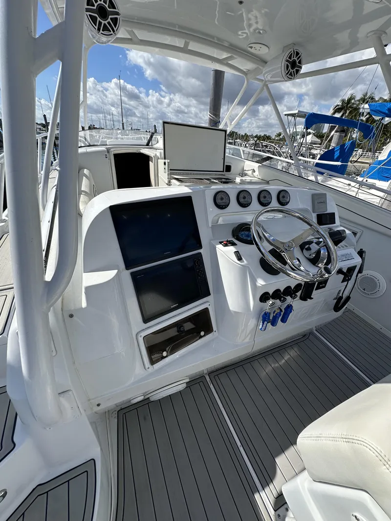 Slide: The Image of 2002 Intrepid 377 Walkaround Cuddy boat cockpit with modern navigation equipment. - 47