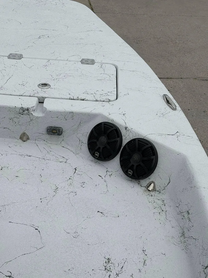 Slide: The Image of 2022 Shoalwater 21 Catamaran deck with speakers and storage hatch. - 14