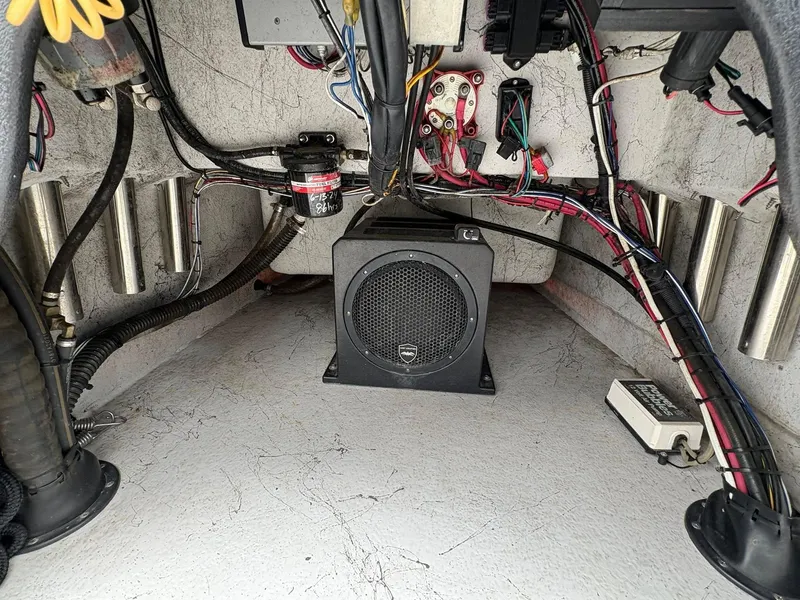 Slide: The Image of Interior view of a 2022 Shoalwater 21 Catamaran showing wiring and equipment setup. - 16