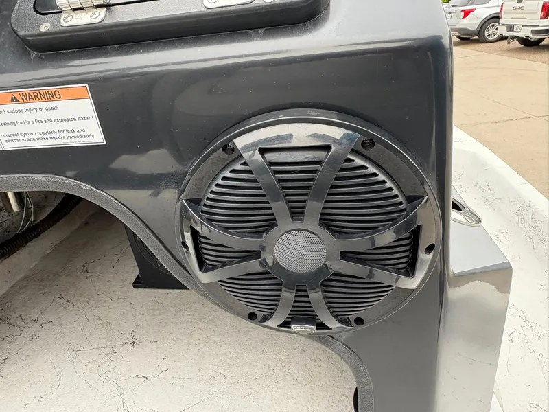 Slide: The Image of Speaker on 2022 Shoalwater 21 Catamaran dashboard with warning label. - 17