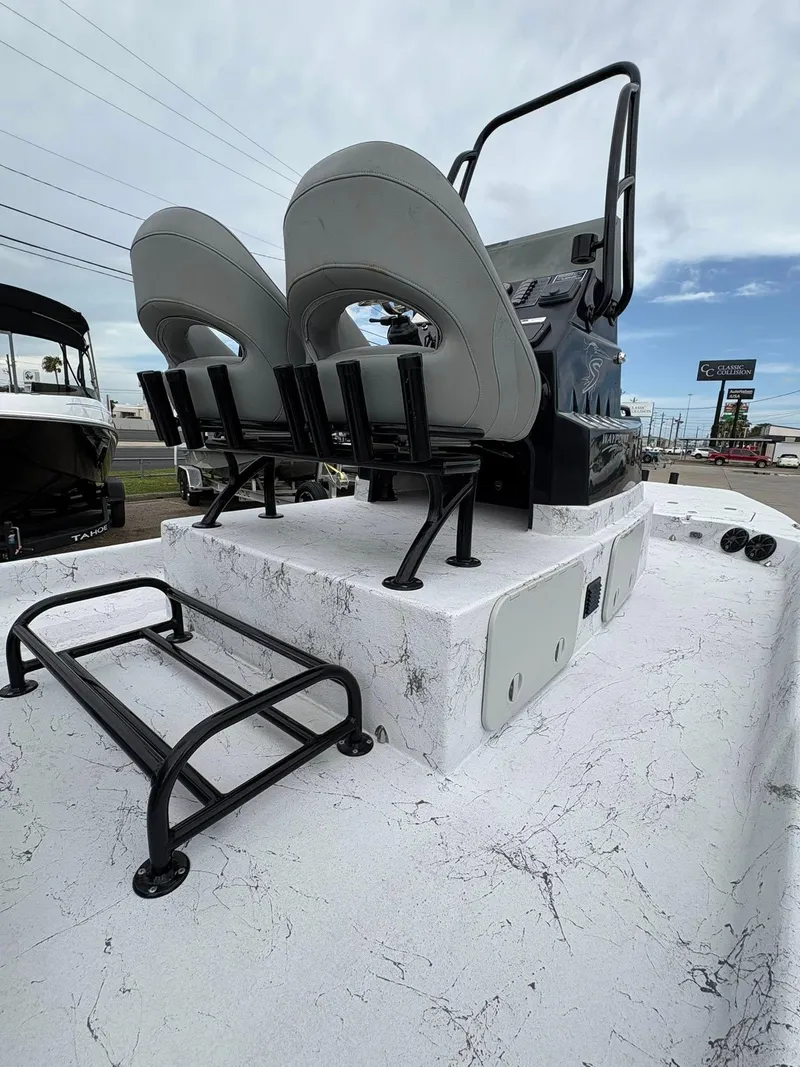 Slide: The Image of 2022 Shoalwater 21 Catamaran boat with dual seats and sturdy railing on deck. - 3