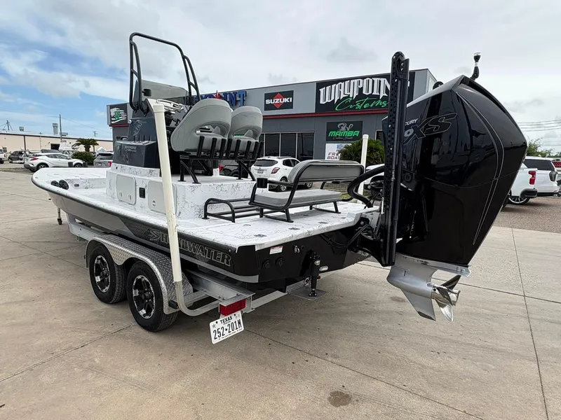 Slide: The Image of 2022 Shoalwater 21 Catamaran boat on trailer, parked outside dealership. - 4