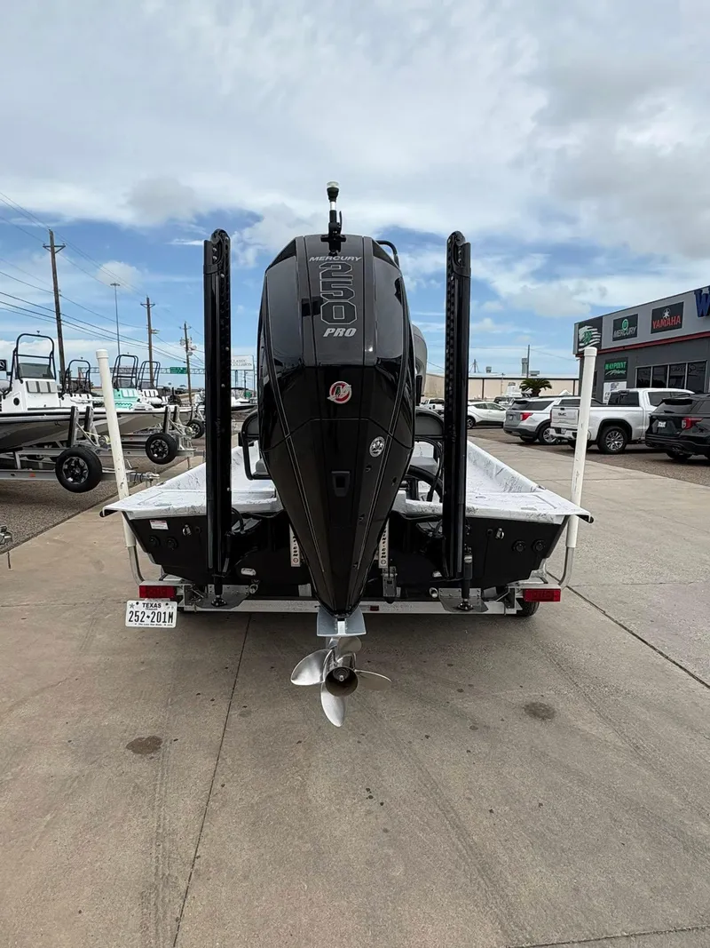 Slide: The Image of 2022 Shoalwater 21 Catamaran with Mercury 250 Pro outboard motor, parked on a trailer. - 6