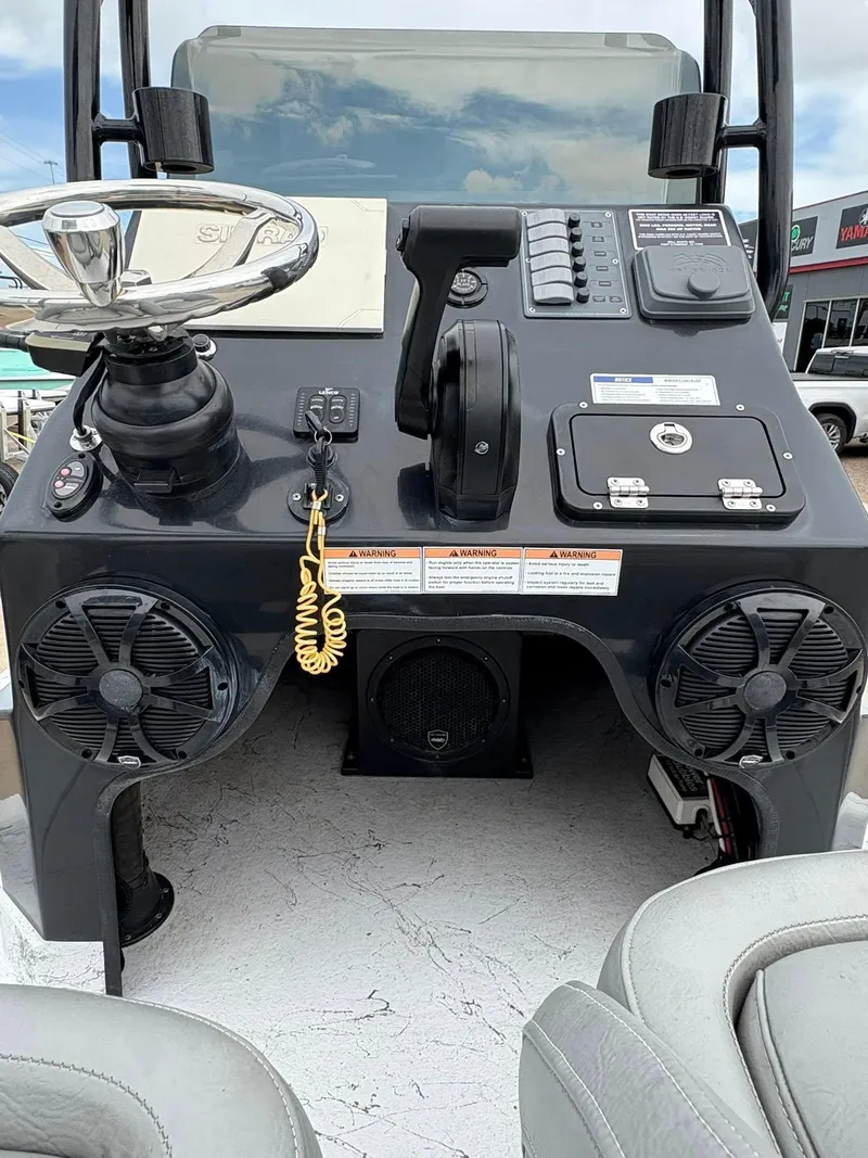 Slide: The Image of Shoalwater 21 Catamaran 2022 dashboard with steering wheel and controls. - 8