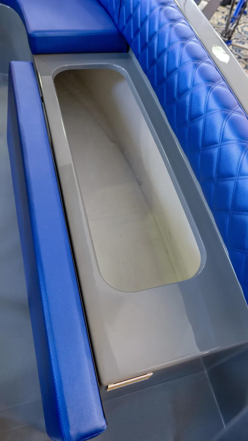 Slide: The Image of 2023 Vision Marine Technologies Volt 180 boat interior with blue quilted seating. - 12