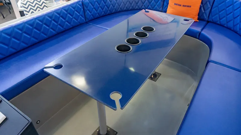 Slide: The Image of Luxurious blue seating area on 2023 Vision Marine Technologies Volt 180 boat. - 11