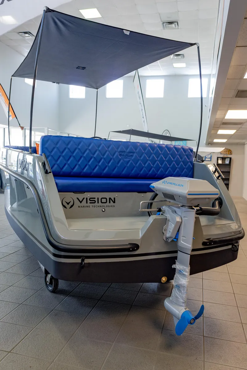 Slide: The Image of 2023 Vision Marine Technologies Volt 180 boat with canopy and electric motor in showroom. - 4